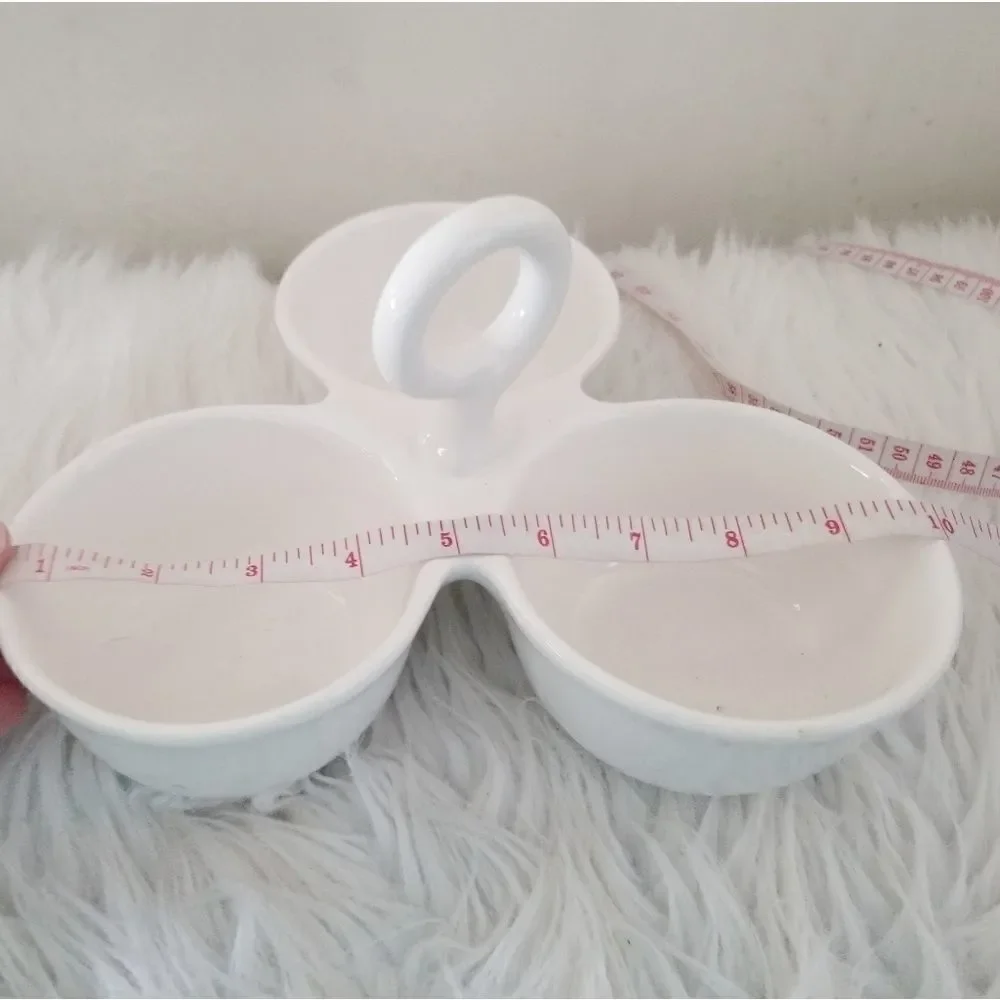 Condiment tray separated dishes.
